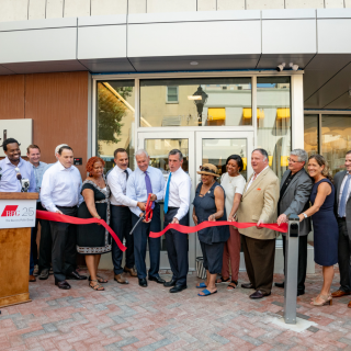 Midtown Park management cutting red ribbon