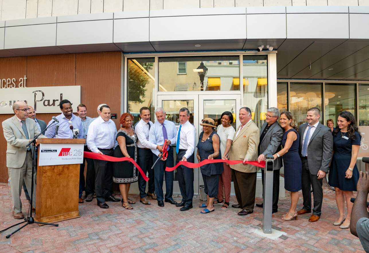 Midtown Park management cutting red ribbon
