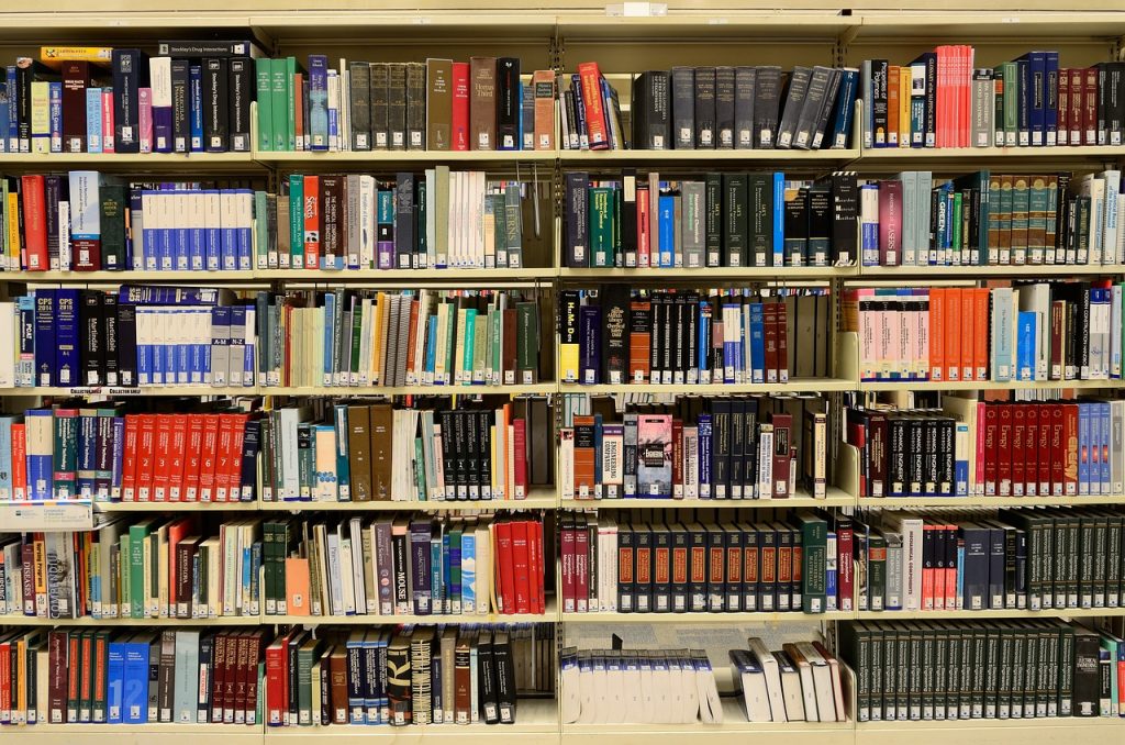 books on shelves in a college library
